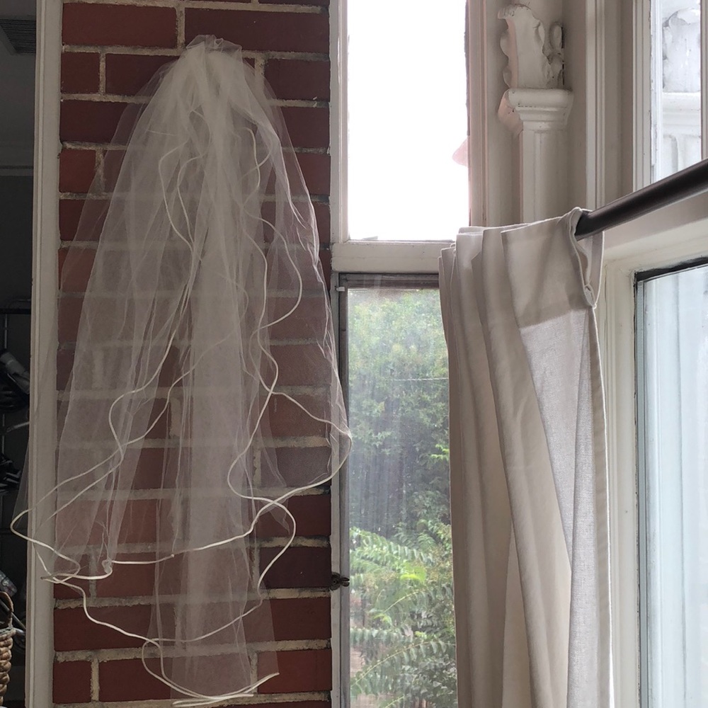 Ivory wedding veil with satin trim and comb